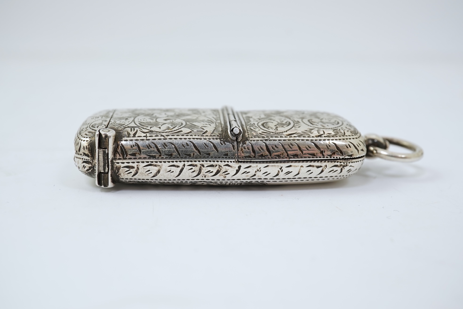 A late Victorian engraved silver oval combination sovereign and vesta case, by W H Tandy & Sons